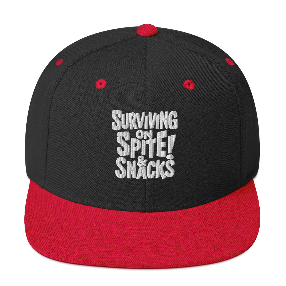Surviving on Spite & Snacks sarcastic hat - snapback black red, front view