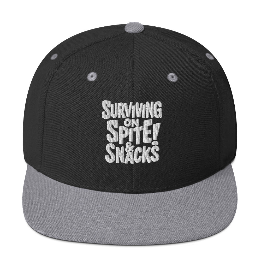 Surviving on Spite & Snacks sarcastic hat - snapback black silver, front view