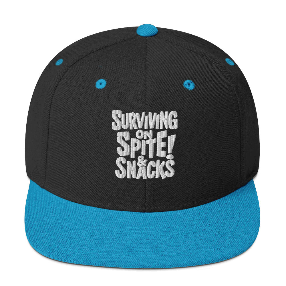 Surviving on Spite & Snacks sarcastic hat - snapback black teal, front view
