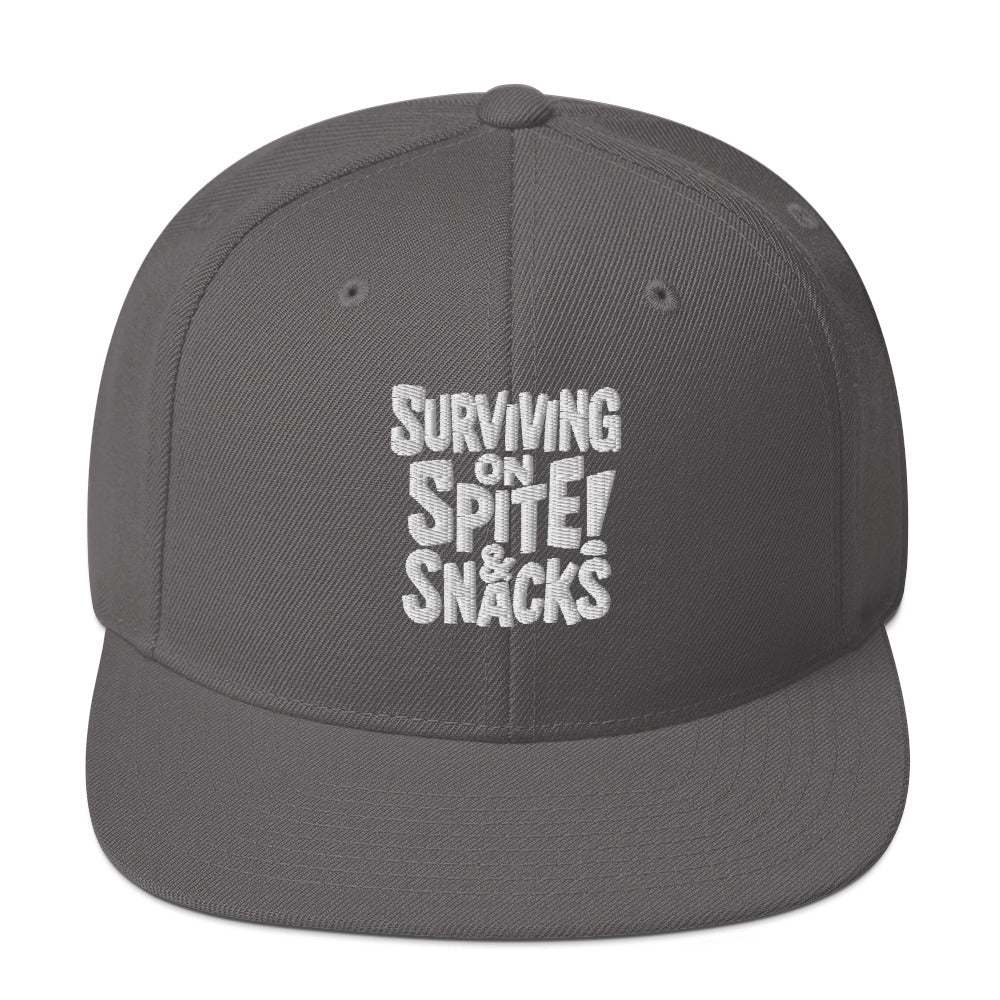 Surviving on Spite & Snacks sarcastic hat - snapback dark grey, front view